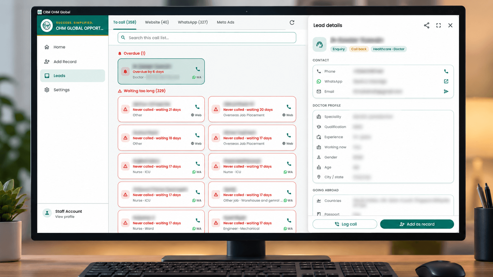 OHM Global CRM on a desktop monitor, showing the call list and a lead's details